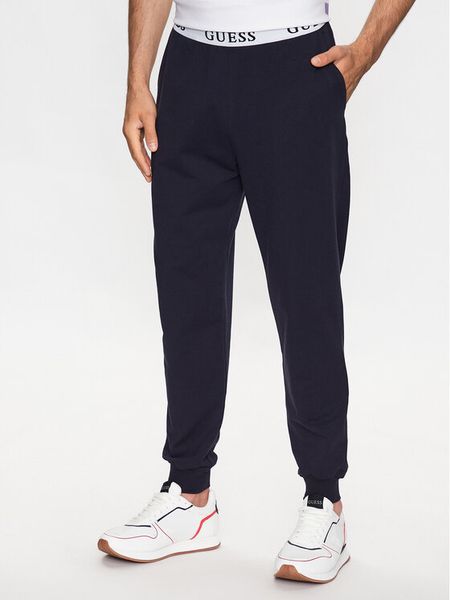 Guess Spodnie piżamowe U3YB00 KBS91 Granatowy Regular Fit. Niebieskie piżamy męskie Guess, l, z aplikacjami, z bawełny, bez ramiączek. Za 169.99 zł.