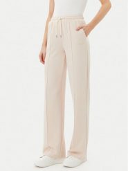 Guess Spodnie dresowe V5RB19 KCOB2 Beżowy Regular Fit. Brązowe spodnie dresowe damskie Guess, m, z aplikacjami, z dresówki. Za 209.99 zł.