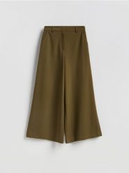 Spodnie z szerokimi nogawkami - ciemnozielony. Zielone spodnie materiałowe damskie Reserved, bez wzorów, z tkaniny. Za 149.99 zł.