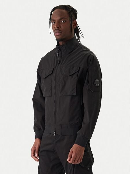 C.P. Company Kurtka przejściowa 20CMOW012A 110264A Czarny Regular Fit. Czarne kurtki męskie C.P. Company, l, bez wzorów, z syntetyku, bez kaptura. Za 1,909.00 zł.
