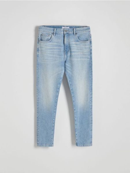 Jeansy slim fit z efektem sprania - niebieski. Niebieskie jeansy męskie Reserved. W wyprzedaży za 69.99 zł.
