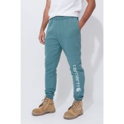 Spodnie męskie dresowe Carhartt Midweight Graphic Jogger. Szare spodnie dresowe męskie Carhartt, bez wzorów, z dresówki. Za 335.99 zł.