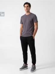 Spodnie dresowe comfort fit z domieszką bawełny - czarny. Czarne spodnie sportowe męskie Sinsay, z bawełny. Za 39.99 zł.