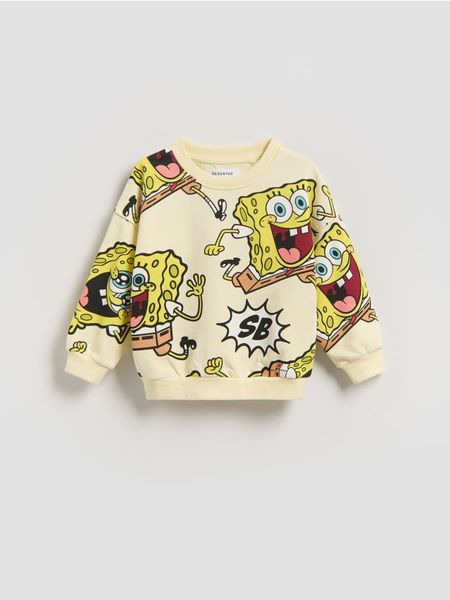 Bluza SpongeBob - jasnożółty. Żółte bluzy i bluzki niemowlęce Reserved, bez wzorów, z bawełny, bez ramiączek, bez kaptura. Za 55.99 zł.