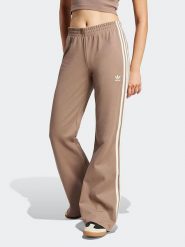 Adidas Spodnie dresowe w kolorze beżowym rozmiar: M. Brązowe spodnie dresowe damskie Adidas, m, bez wzorów, z dresówki. Za 226.77 zł.