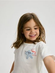 T-shirt z morskim motywem - złamana biel. Zielone koszulki dziewczęce Reserved, bez wzorów, z bawełny, bez ramiączek. W wyprzedaży za 15.99 zł.