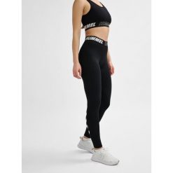 Damskie bawełniane legginsy o średnim kroju Hummel TE Maja. Czarne legginsy sportowe damskie HUMMEL, xs, bez wzorów, z bawełny, na fitness i siłownię. Za 121.50 zł.