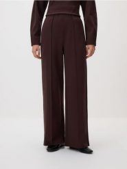 Spodnie z szeroką nogawką - ciemnobrązowy. Brązowe spodnie materiałowe damskie Reserved, bez wzorów, z bawełny. Za 99.99 zł.