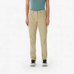 Spodnie turystyczne damskie Quechua MH500. Brązowe spodnie materiałowe damskie QUECHUA, bez wzorów, z bawełny, sportowe. Za 129.99 zł.