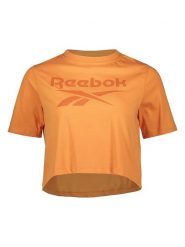 Reebok Koszulka w kolorze pomarańczowym rozmiar: L. Pomarańczowe bluzki damskie Reebok, l, bez wzorów, bez kołnierzyka. Za 61.46 zł.