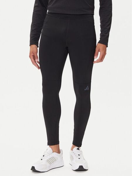 Adidas Legginsy Own The Run Winterized JN9597 Czarny Slim Fit. Czarne spodnie sportowe męskie Adidas, z syntetyku. Za 299.99 zł.