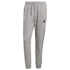 Spodnie męskie adidas Essentials Tapered Cuff 3 Stripes. Czarne spodnie sportowe męskie Adidas, z polaru. Za 214.25 zł.