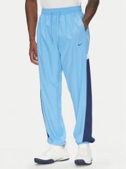 Nike Spodnie dresowe Icon FZ0250 Niebieski Relaxed Fit. Niebieskie spodnie dresowe męskie Nike, bez wzorów, z dresówki. Za 299.99 zł.