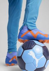 Męskie spodnie treningowe Manchester City PUMA Magic Blue Yellow Glow. Niebieskie spodnie materiałowe męskie Puma, bez wzorów. Za 268.70 zł.