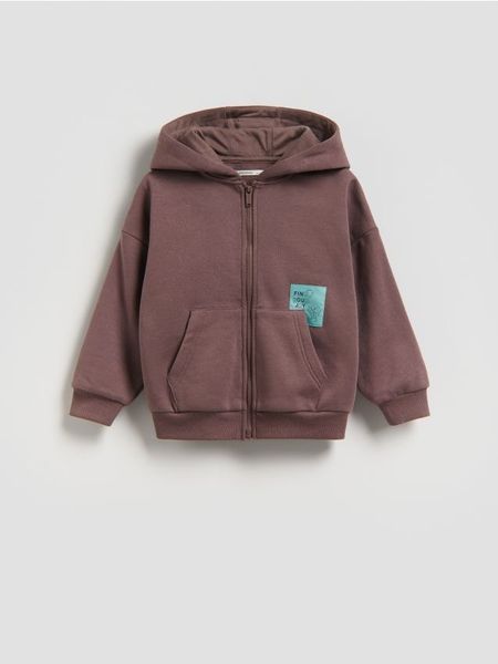 Bawełniana bluza z kapturem - brązowy. Brązowe bluzy i bluzki niemowlęce Reserved, bez wzorów, z bawełny, bez ramiączek, z kapturem. Za 49.99 zł.