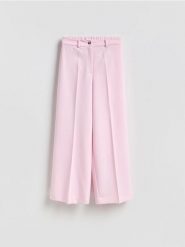 Luźne spodnie - różowy. Czerwone spodnie materiałowe damskie Reserved, bez wzorów, z tkaniny. Za 129.99 zł.