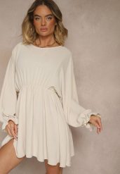 Jasnobeżowa Rozkloszowana Sukienka z Gumką w Talii i przy Mankietach Tesunela. Brązowe sukienki damskie Renee, na co dzień, bez wzorów, eleganckie, bez kołnierzyka, bez ramiączek, mini, rozkloszowane. W wyprzedaży za 71.99 zł.