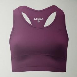 Crop top sportowy treningowy FEBE. Fioletowe topy sportowe damskie Legea, l, bez wzorów, z materiału, bez ramiączek. W wyprzedaży za 84.50 zł.