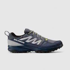 Buty turystyczne męskie Salomon Saliba wodoodporne. Niebieskie buty trekkingowe męskie Salomon, z materiału, bez zapięcia, trekkingowe. W wyprzedaży za 369.99 zł.