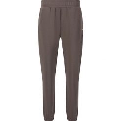 Damskie spodnie dresowe Athlecia Jillnana V2. Czarne spodnie dresowe damskie Athlecia, bez wzorów, z dresówki. Za 239.50 zł.