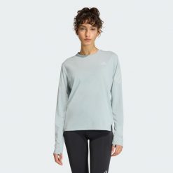 Koszulka z długim rękawem adi365 CLIMACOOL. Zielone bluzki sportowe damskie Adidas, bez kołnierzyka, bez ramiączek. Za 179.00 zł.