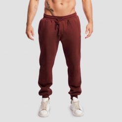 Spodnie męskie fitness oversize ze sznurkiem wiśniowe Base. Czerwone spodnie sportowe męskie GYMBEAM, z bawełny. Za 137.90 zł.