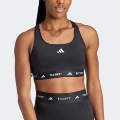 Stanik fitness ADIDAS. Biustonosze sportowe damskie Adidas, bez wzorów, ze skóry. W wyprzedaży za 99.99 zł.