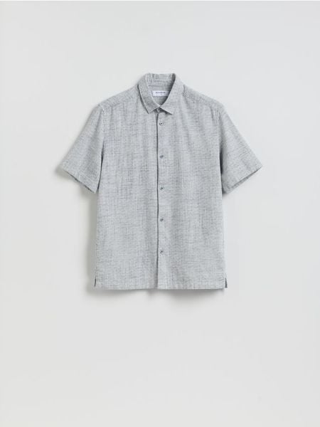 Strukturalna koszula regular fit - granatowy. Niebieskie koszule męskie Reserved, l, bez wzorów, z bawełny, bez kołnierzyka, bez ramiączek. Za 119.99 zł.