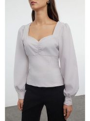 Trendyol Bluzka w kolorze białym rozmiar: 38. Białe bluzki damskie Trendyol, bez wzorów, bez kołnierzyka, bez ramiączek. Za 60.99 zł.