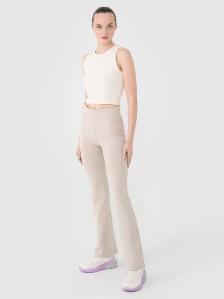 4F Legginsy z rozszerzanymi nogawkami damskie - beżowe L. Brązowe legginsy damskie 4f, l, bez wzorów, z bawełny. W wyprzedaży za 59.99 zł.