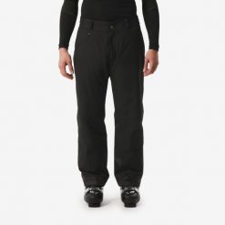 Spodnie narciarskie męskie Wedze PANT SKI 100. Czarne spodnie materiałowe męskie WED'ZE, bez wzorów, z materiału, sportowe. Za 179.99 zł.