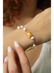 Pierres delicates Pozłacana bransoletka z kryształami rozmiar: onesize. Pomarańczowe bransoletki damskie Pierres delicates, pozłacane. Za 87.19 zł.