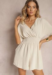 Beżowy Kombinezon Kopertowy z Gumką w Pasie Fandrea. Brązowe kombinezony damskie Renee, bez wzorów, z jeansu, eleganckie, bez kołnierzyka, bez ramiączek. Za 44.99 zł.