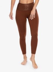 Legginsy damskie Super.natural Arabesque Tights. Brązowe legginsy sportowe damskie Super.natural, s, bez wzorów, z materiału, na fitness i siłownię. Za 179.99 zł.
