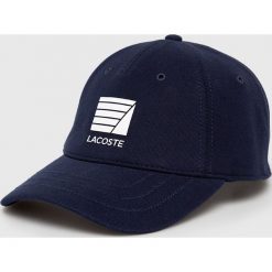 Lacoste - Czapka. Białe czapki męskie Lacoste, bez wzorów, z bawełny. W wyprzedaży za 129.90 zł.