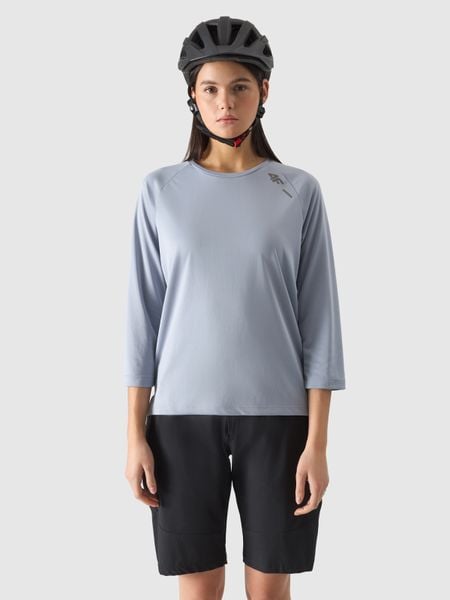 4F Koszulka rowerowa z długim rękawem damska - niebieska S. Niebieskie bluzki sportowe damskie 4f, l, bez wzorów, z dzianiny, bez ramiączek. W wyprzedaży za 79.99 zł.