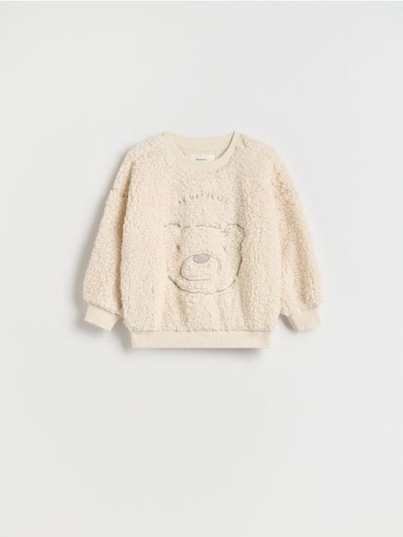 Bluza z haftem - złamana biel. Bluzy i bluzki niemowlęce Reserved, bez wzorów, bez ramiączek, bez kaptura. W wyprzedaży za 22.99 zł.