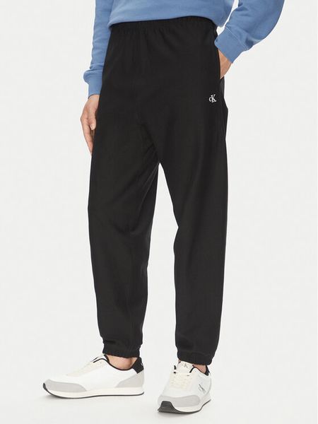 Calvin Klein Jeans Spodnie dresowe Premium LV04RC279G Czarny Regular Fit. Czarne spodnie dresowe męskie Calvin Klein Jeans, bez wzorów, z bawełny. Za 279.99 zł.