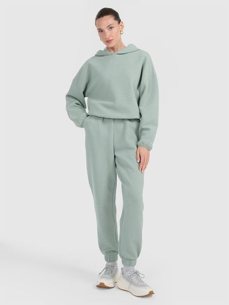 4F Spodnie dresowe z waflowej dzianiny damskie - turkusowe L. Niebieskie spodnie dresowe damskie 4f, l, bez wzorów, z dresówki. W wyprzedaży za 119.99 zł.