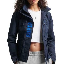 Damska kurtka wodoodporna Superdry Ultimate Windcheater. Niebieskie kurtki damskie Superdry., bez wzorów, bez kaptura. Za 497.95 zł.