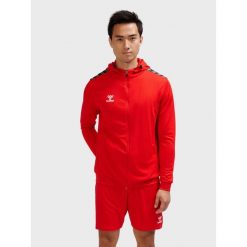 Poliestrowa bluza dresowa z kapturem i zamkiem błyskawicznym Hummel Authentic. Czerwone bluzy sportowe męskie HUMMEL, bez wzorów, z dresówki, sportowe, bez kołnierzyka, bez ramiączek. Za 254.50 zł.