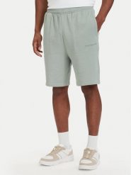 Tommy Hilfiger Szorty sportowe Essential UM0UM03914 Zielony jasny Regular Fit. Zielone szorty męskie Tommy Hilfiger, bez wzorów, z bawełny, sportowe. Za 209.99 zł.