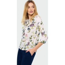 Bluzka z ozdobnym wiązaniem. Bluzki damskie Greenpoint, bez wzorów, z poliesteru, bez kołnierzyka, bez ramiączek. Za 24.99 zł.