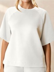 Bluza z krótkim rękawem soft touch - kremowy. Białe bluzy bez kaptura damskie Sinsay, l, z dzianiny. Za 39.99 zł.