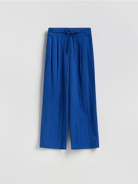 Luźne spodnie z lyocellem - niebieski. Niebieskie spodnie materiałowe damskie Reserved, bez wzorów, z lyocellu. Za 139.99 zł.