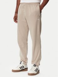 Adidas Spodnie dresowe Trefoil Essentials French Terry KT2454 Beżowy Regular Fit. Brązowe spodnie dresowe męskie Adidas, bez wzorów, z bawełny. Za 239.99 zł.