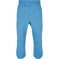 Spodnie dresowe Urban Classics. Niebieskie spodnie dresowe męskie Urban Classics, bez wzorów, z dresówki. Za 191.00 zł.