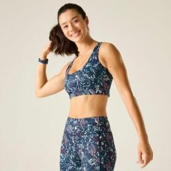 Biustonosz sportowy Influential Medium Support dla kobiet. Niebieskie biustonosze sportowe damskie Dare 2b, bez wzorów, z elastanu. W wyprzedaży za 139.99 zł.