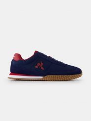Buty Le Coq Sportif Veloce. Niebieskie buty wizytowe męskie Le Coq Sportif, z materiału, bez zapięcia. Za 387.00 zł.