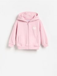 Luźna bluza z kapturem - różowy. Czerwone bluzy i bluzki niemowlęce Reserved, bez wzorów, z bawełny, bez ramiączek, z kapturem. Za 49.99 zł.
